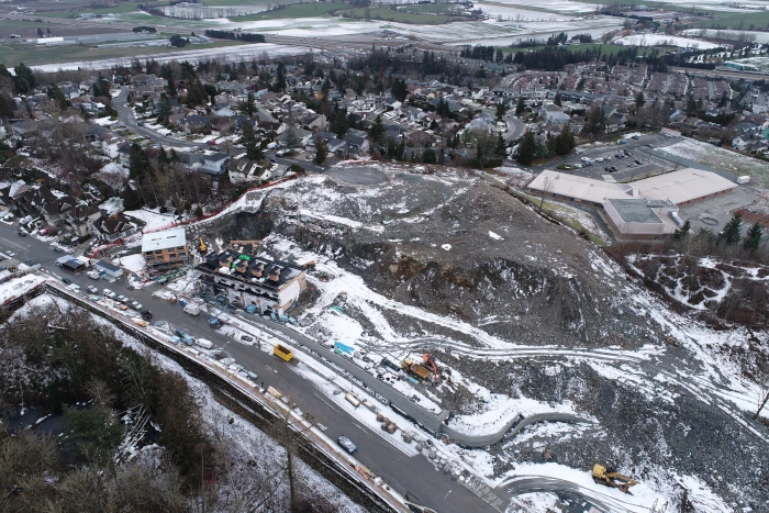 Arial image from a drone surveying the construction of mountainview townhouse project in the winter.